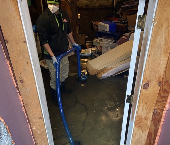 man in basement with blue pump