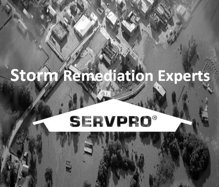 Image of flooded town with SERVPRO Logo and text, Storm Remediation Experts